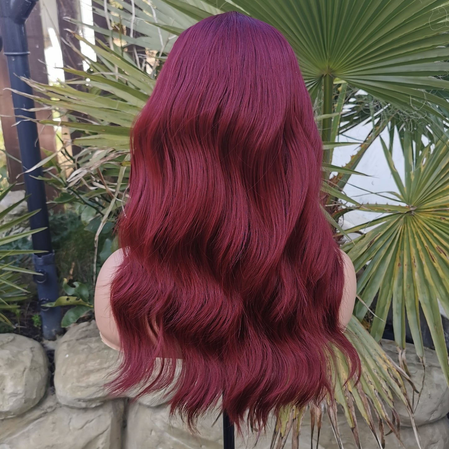 Fiesty Dark red long wavy synthetic wig.