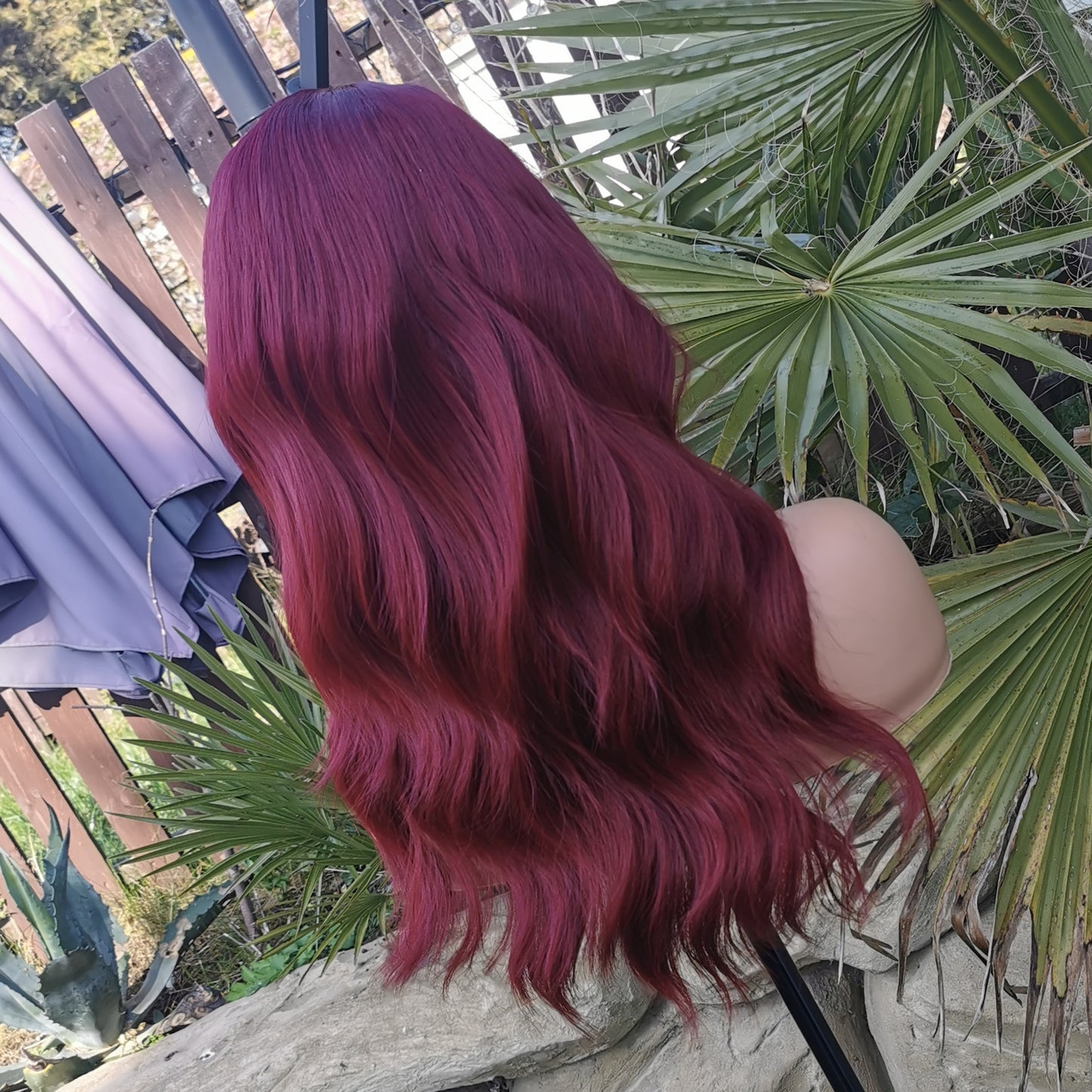 Fiesty Dark red long wavy synthetic wig.